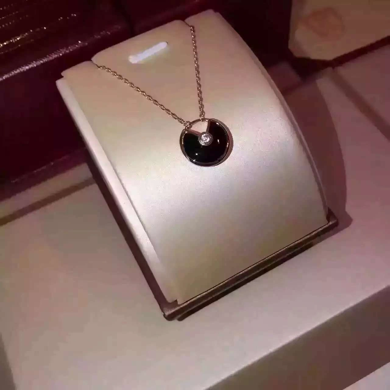 Amulette de Cartier Black Onyx Diamond Necklack in Yellow Gold, White Gold and Pink Gold