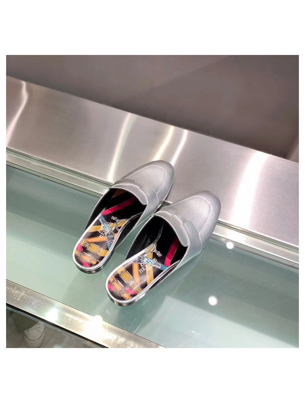 Hermes Catena Mules In Silver Metallic Calfskin