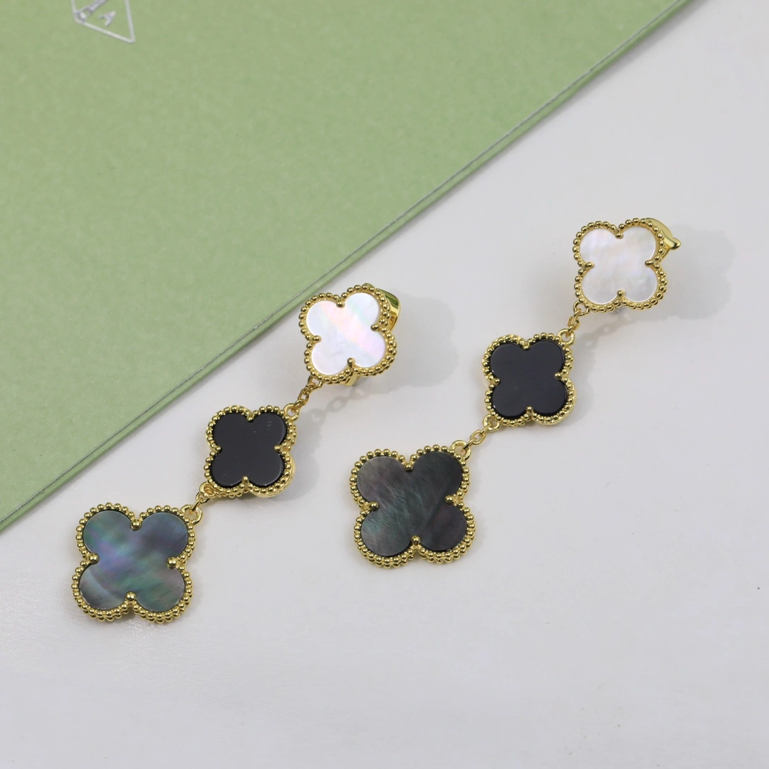 Van Cleef & Arpels Magic Alhambra Earrings 3 Motifs Yellow Gold in White and Gray mother-of-pearl and Onyx