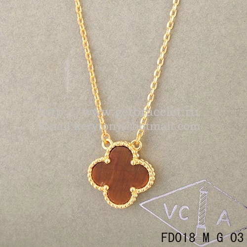 Van Cleef & Arpels Vintage Alhambra Pendant Yellow Gold With Tiger’s Eye Mother Of Pearl 15mm