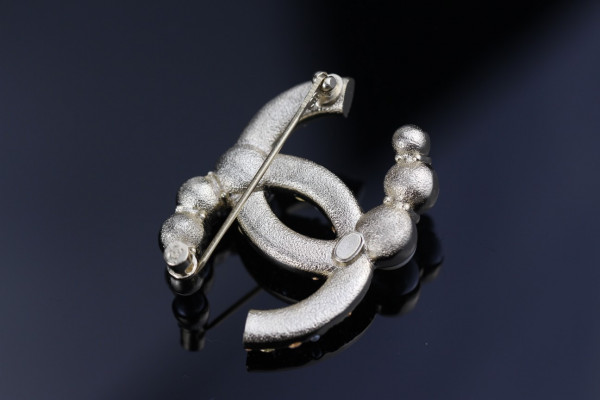 CL BROOCH