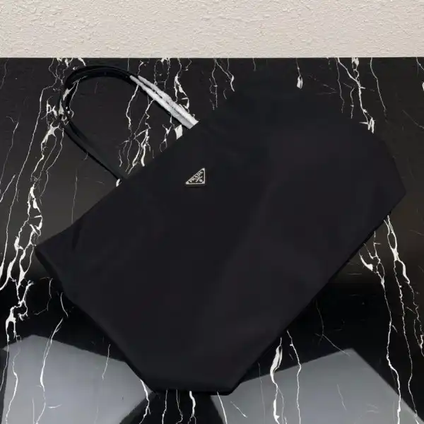 First bag ru PRADA Re-Nylon and Saffiano leather tote bag