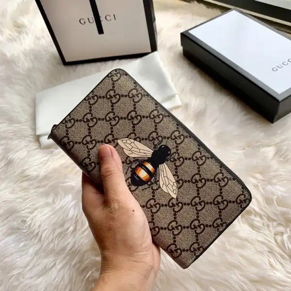 GUCCI Bee print GG zip around wallet