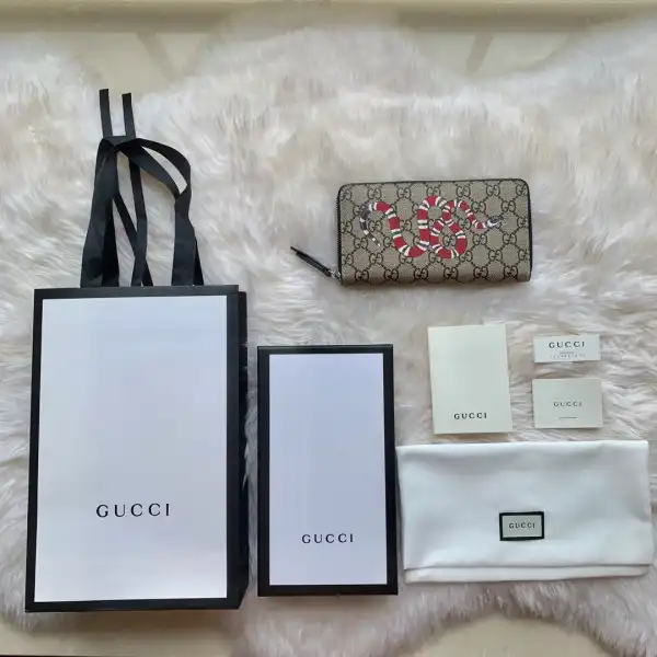 First bag ru GUCCI Bee print GG zip around wallet