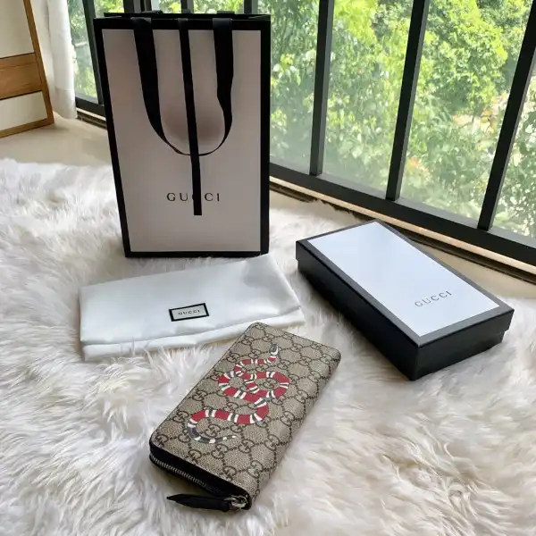 First bag ru GUCCI Bee print GG zip around wallet