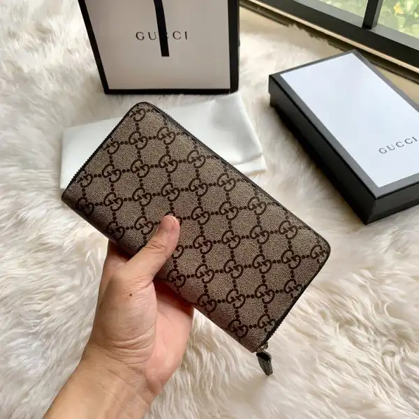 First bag ru GUCCI Bee print GG zip around wallet