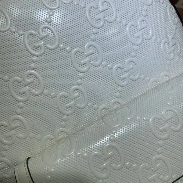 First bag ru GUCCI GG embossed backpack