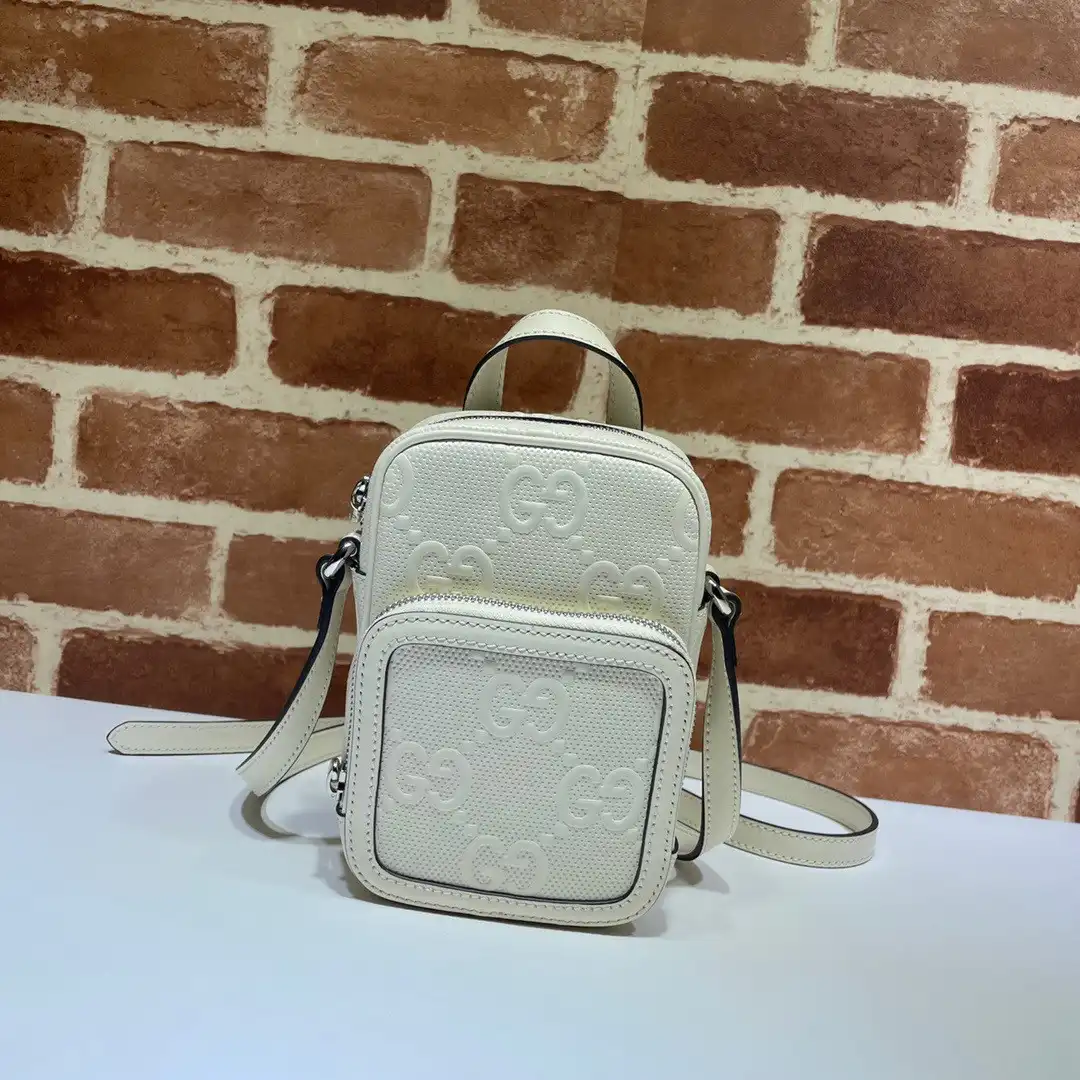 First bag ru GUCCI GG embossed mini bag