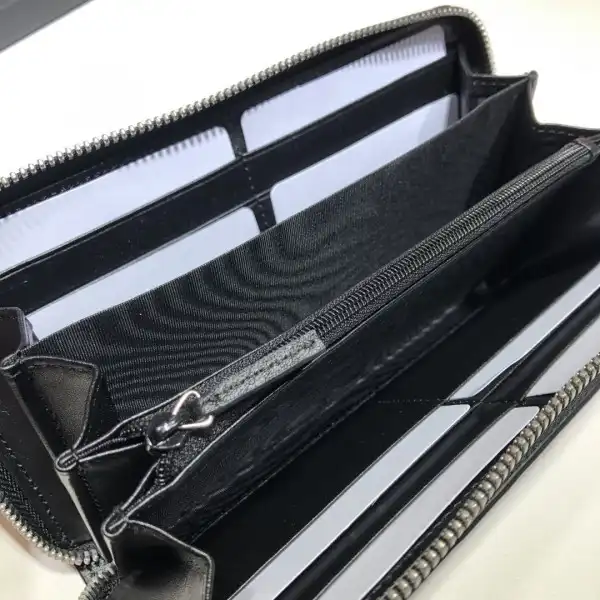 Affordable GUCCI GG embossed zippy wallet