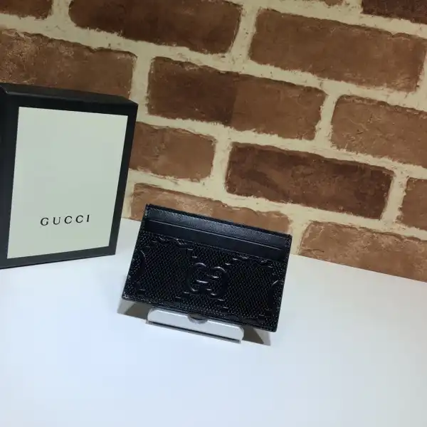 First bag ru GUCCI GG embossed card case