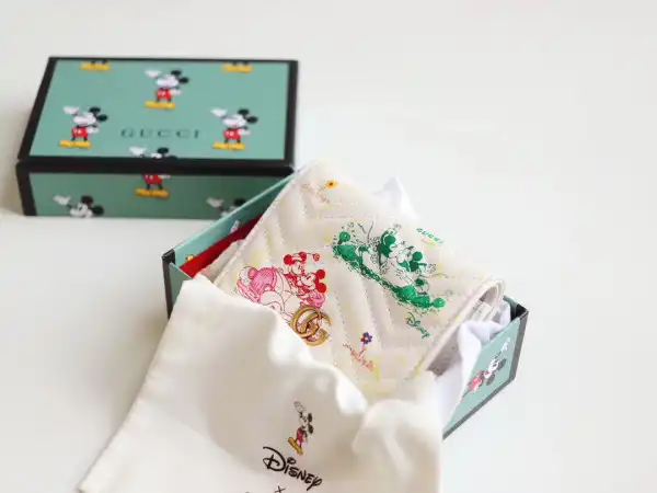 First bag ru Disney X Gucci wallet