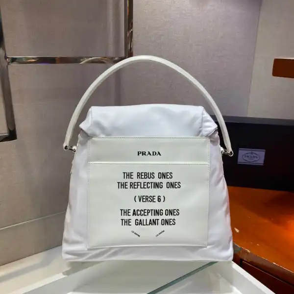 First bag ru PRADA Signaux nylon and leather hobo bag