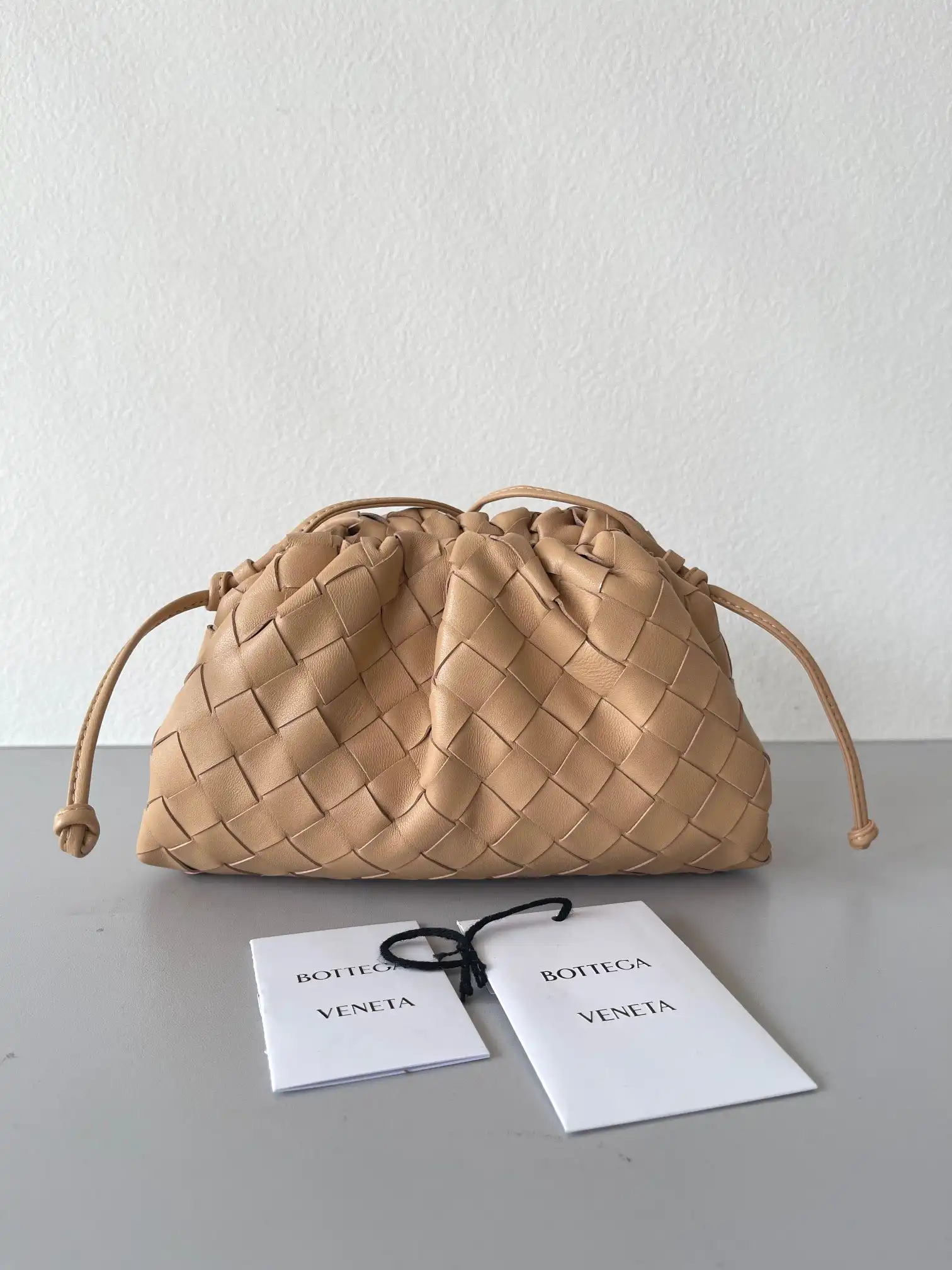 First Bag Ru BOTTEGA VENETA MINI POUCH