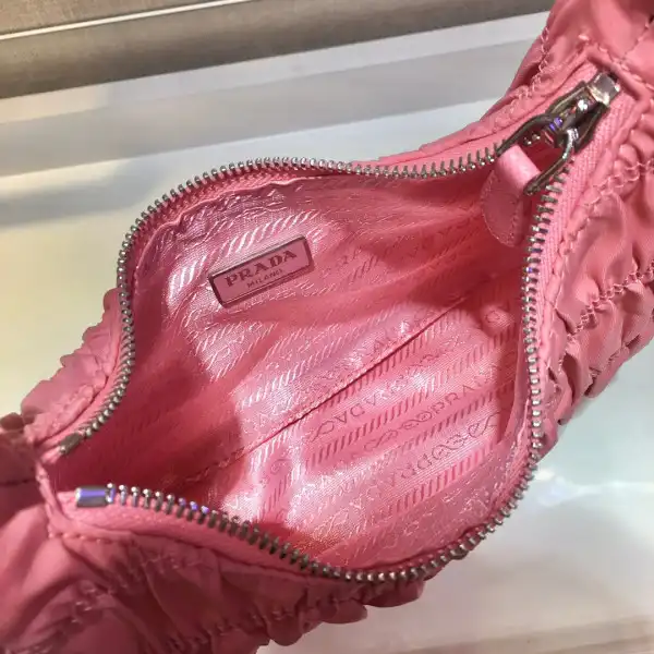 First bag ru PRADA NYLON AND SAFFIANO LEATHER MINI BAG