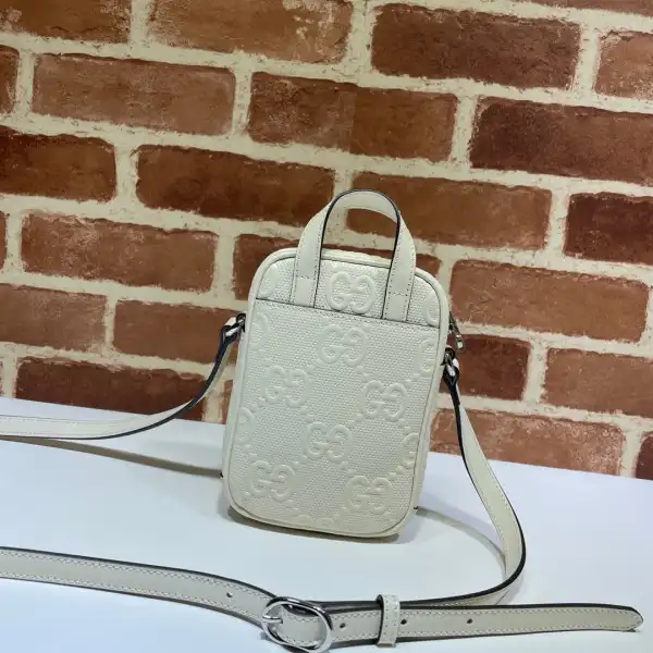 First bag ru GUCCI GG embossed mini bag