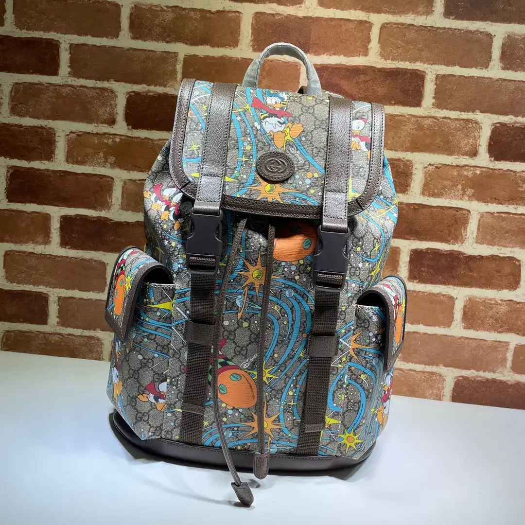 First bag ru Disney x Gucci Donald Duck medium backpack