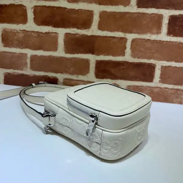 First bag ru GUCCI GG embossed mini bag