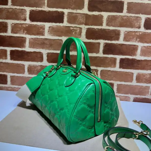 First bag ru GUCCI GG matelassé leather top handle bag