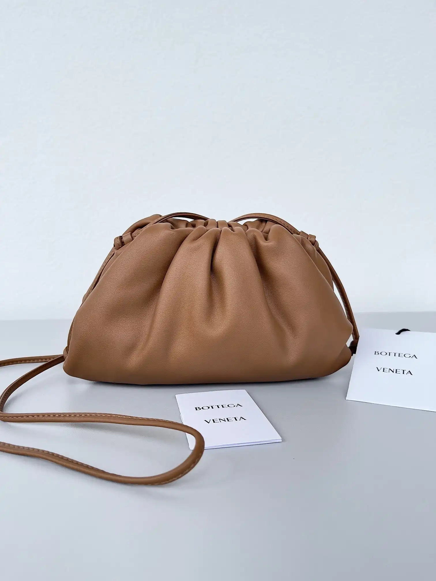 First Bag Ru BOTTEGA VENETA MINI POUCH