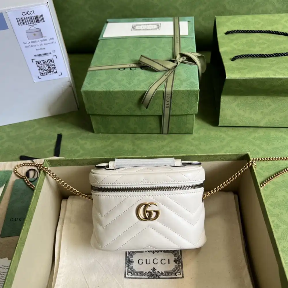 First bag ru GUCCI GG Marmont mini top handle bag