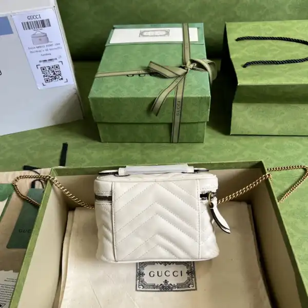 First bag ru GUCCI GG Marmont mini top handle bag