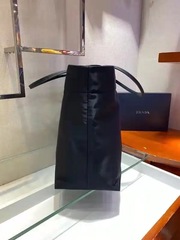 First bag ru PRADA Re-Nylon and Saffiano leather tote bag