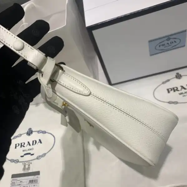 First bag ru Prada Re-Edition Saffiano leather mini bag