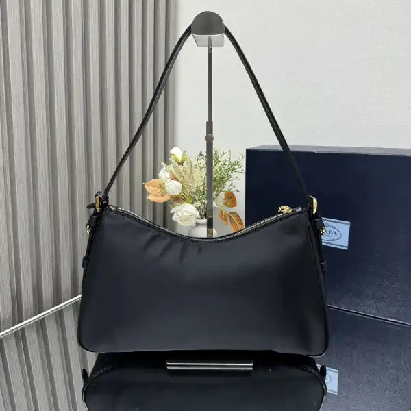 First bag ru Prada Aimée large Re-Nylon shoulder bag with padlock