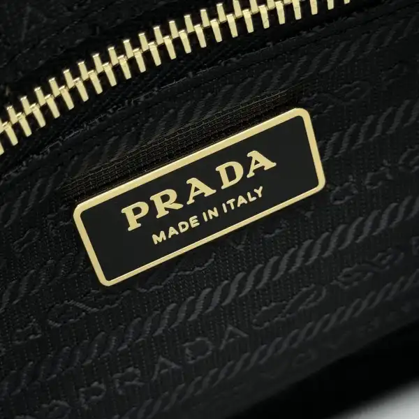 First bag ru Prada Aimée large Re-Nylon shoulder bag with padlock