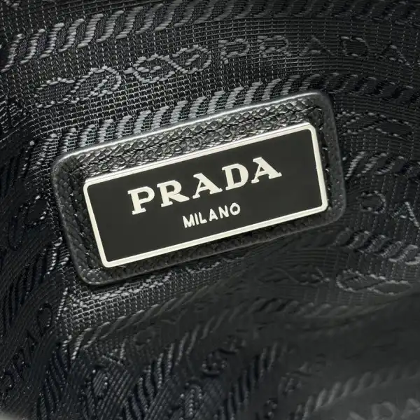 First bag ru Prada Re-Nylon and Saffiano leather shoulder bag