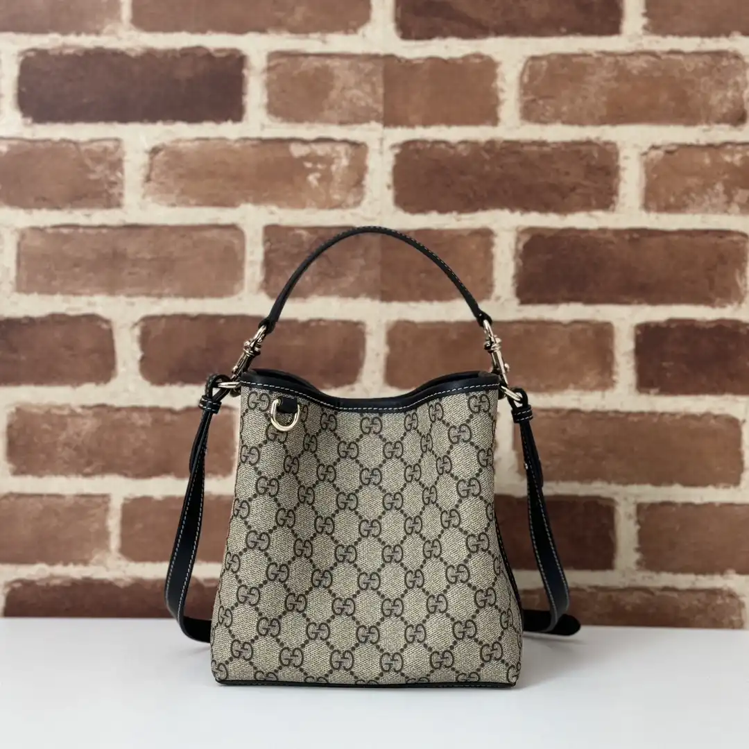 First bag ru Gucci GG Emblem mini bucket bag