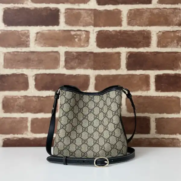 First bag ru Gucci GG Emblem mini bucket bag