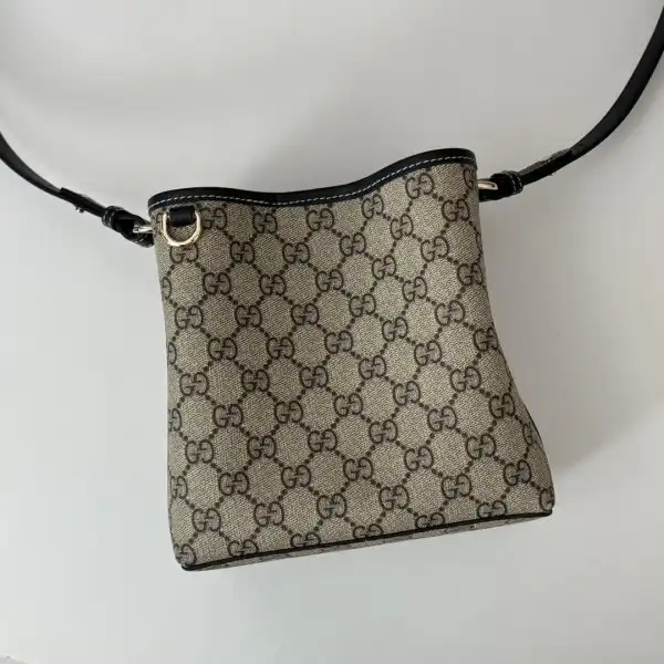 First bag ru Gucci GG Emblem mini bucket bag