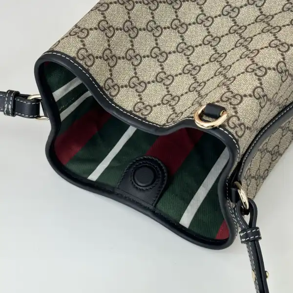 First bag ru Gucci GG Emblem mini bucket bag