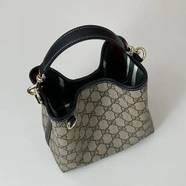 First bag ru Gucci GG Emblem mini bucket bag