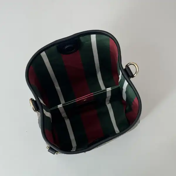 First bag ru Gucci GG Emblem mini bucket bag