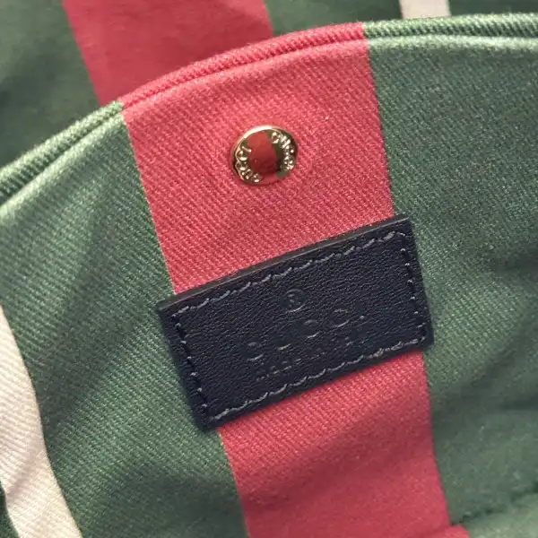 First bag ru Gucci GG Emblem mini bucket bag