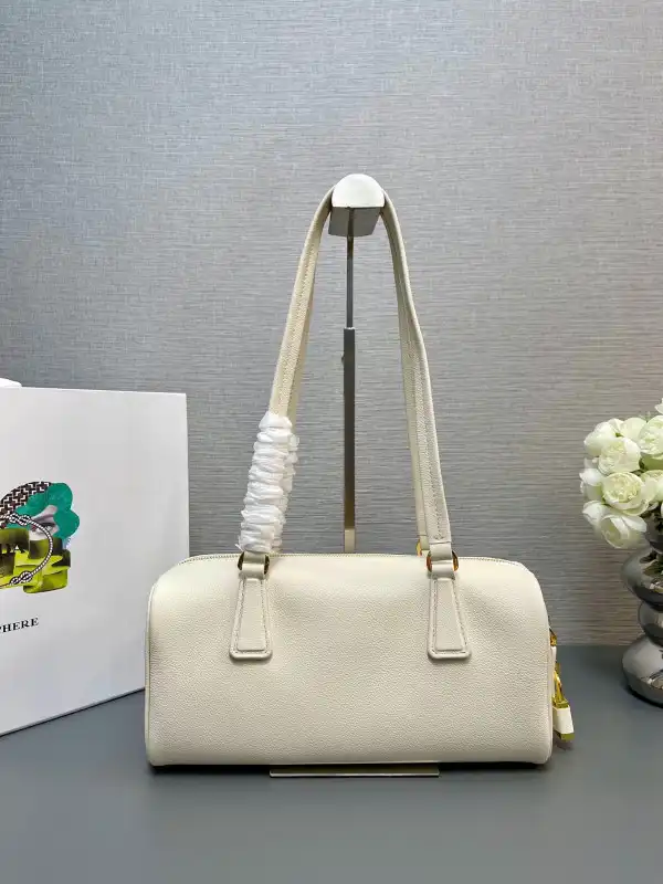 First bag ru Prada Re-Nylon medium top-handle bag with padlock