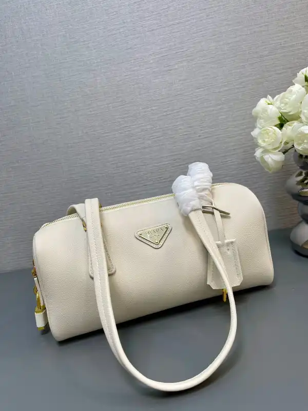 First bag ru Prada Re-Nylon medium top-handle bag with padlock