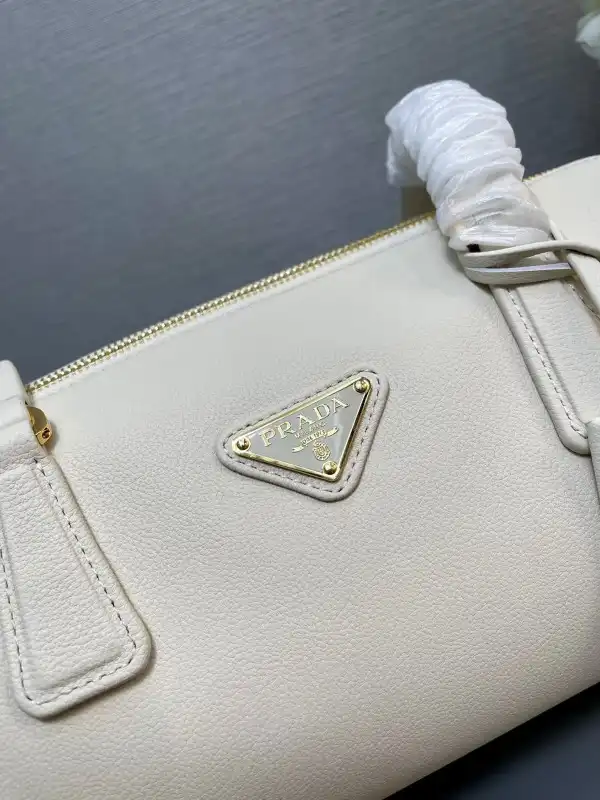 First bag ru Prada Re-Nylon medium top-handle bag with padlock