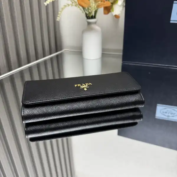 First bag ru Prada Large Saffiano Leather Wallet