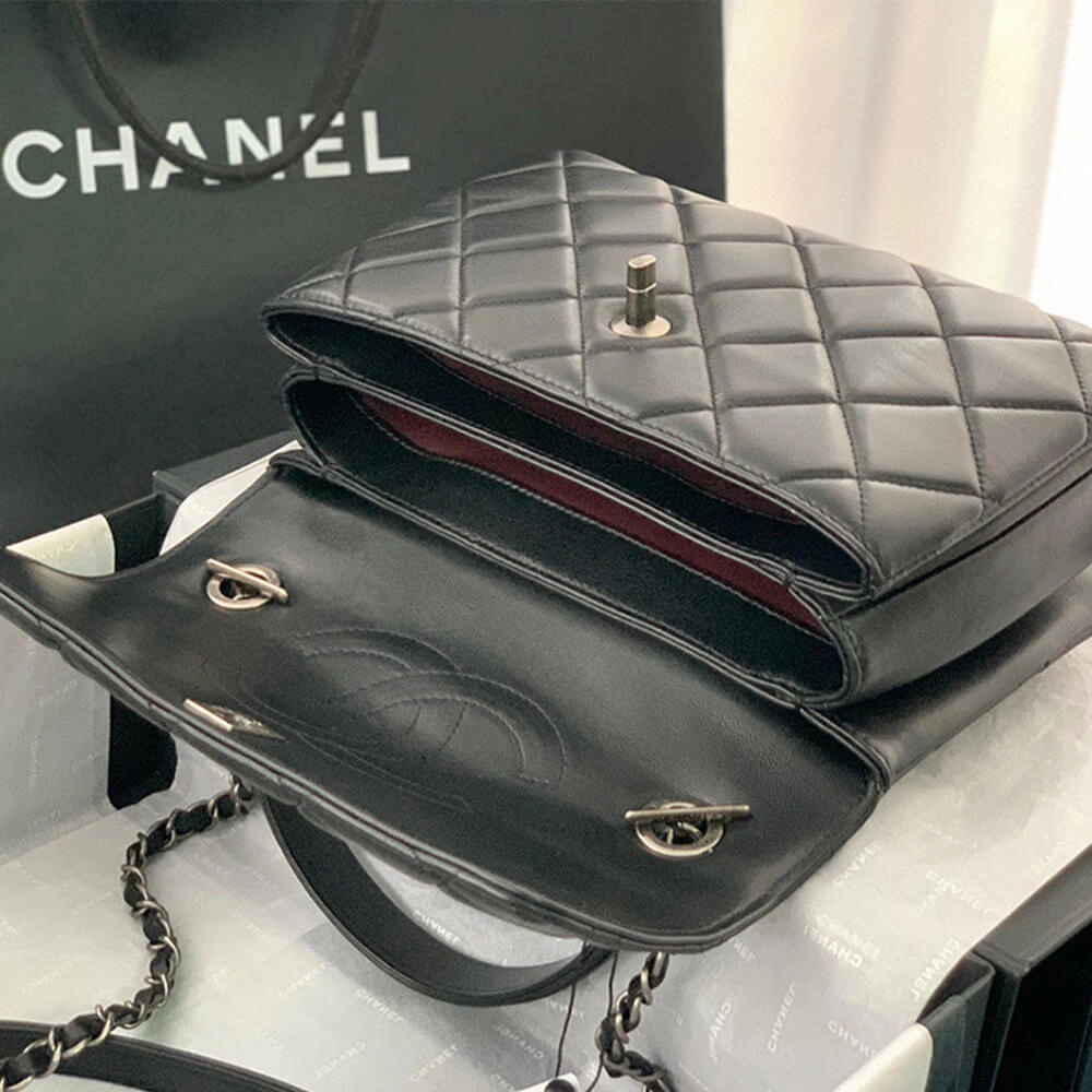 Sleek CHANEL FLAP BAG WITH TOP HANDLE 1695