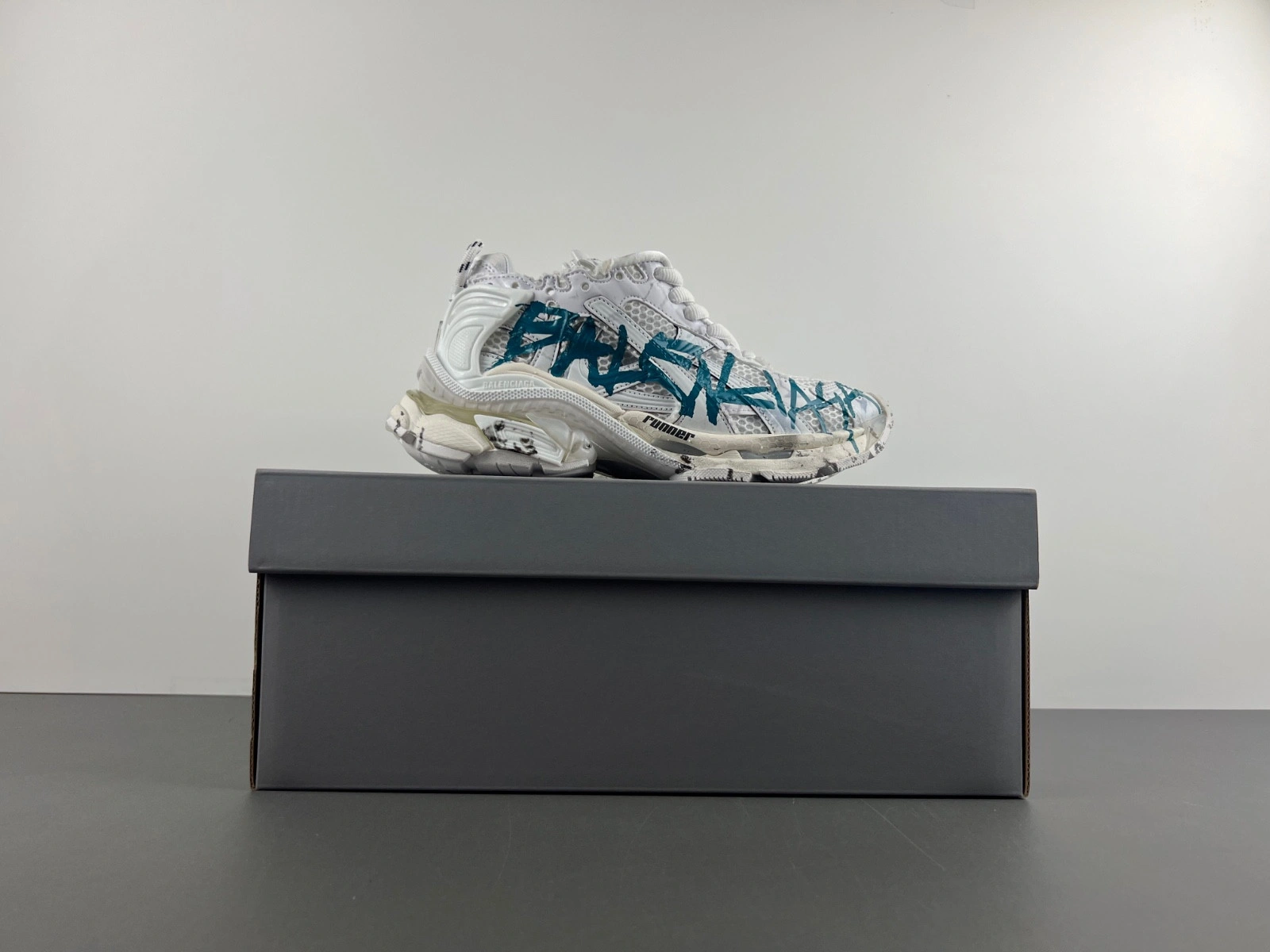 Balenciaga   Runner Graffiti Sneaker in White blue