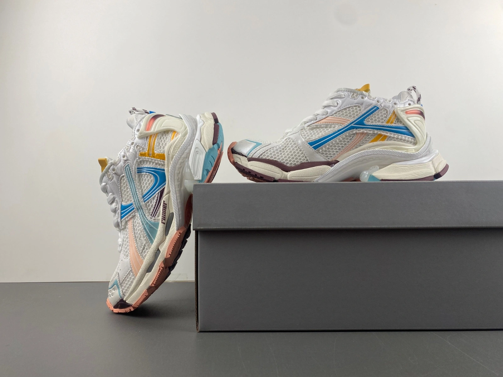 Balenciaga   Runner Sneaker in White yellow pink blue