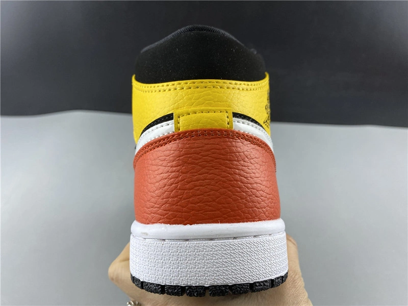Jordan 1 Mid Black Amarillo Orange - 852542-087