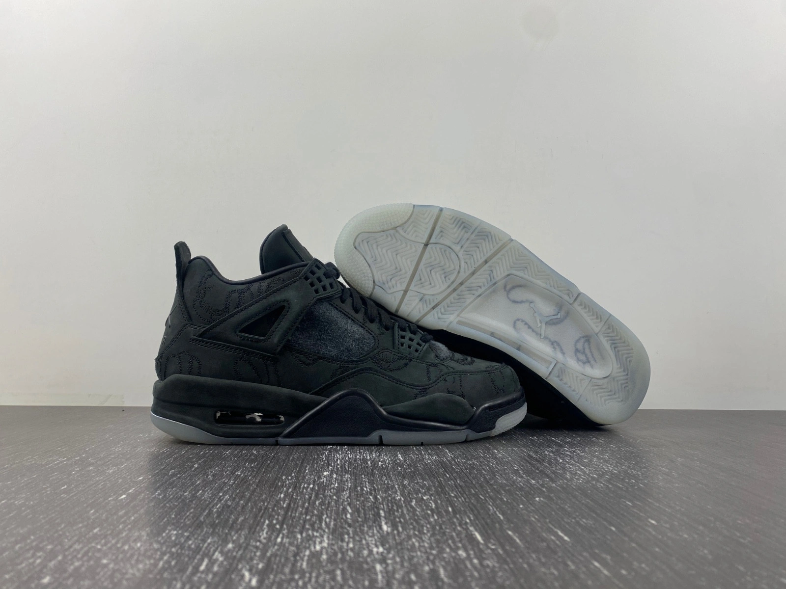 KAWS x Air Jordan 4 Retro 'Black' - 930155 001