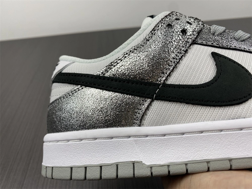 The Nike Dunk Low Features Silver Cracked Leather  DO5882-001