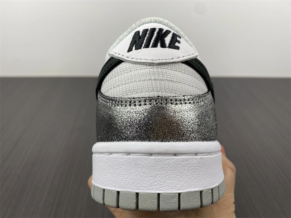 The Nike Dunk Low Features Silver Cracked Leather  DO5882-001