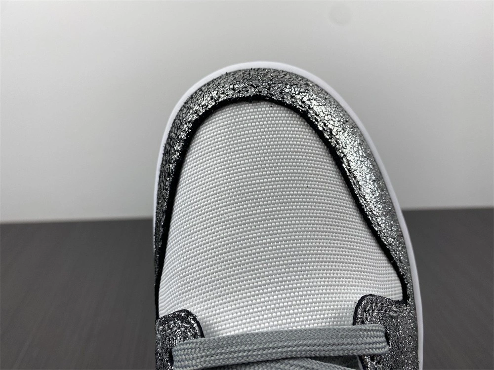The Nike Dunk Low Features Silver Cracked Leather  DO5882-001
