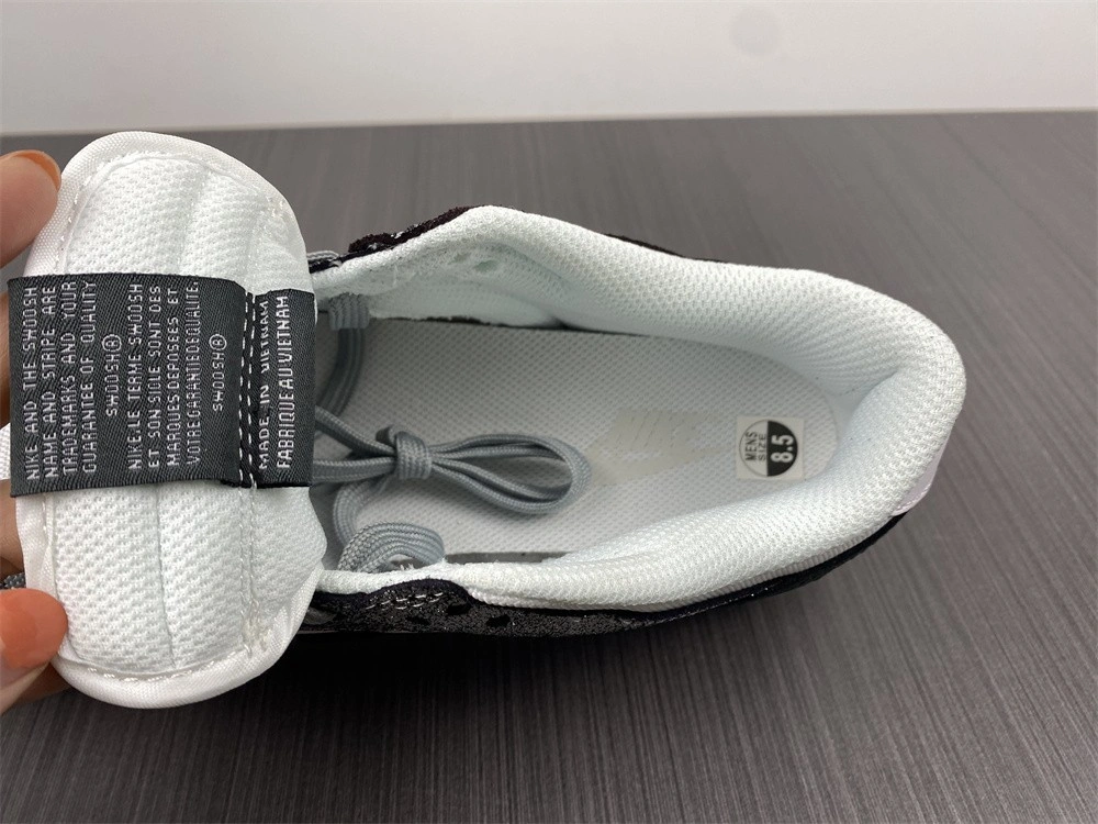 The Nike Dunk Low Features Silver Cracked Leather  DO5882-001